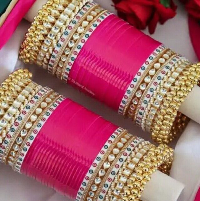 Gorgeous Hot Pink Chura Teamed with Ghunghroos and Heavy-work Golden Bangles